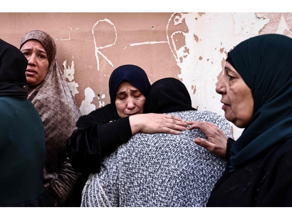 Women grieve during the funeral of Ahmad Zyoud in the village of Silat al-Harithiya, close to the northern West Bank city of Jenin on December 21, 2025. (Photo by Zain JAAFAR / AFP)
