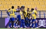 Al Gharafa players celebrate after Seydou Sano scored the late winner.
