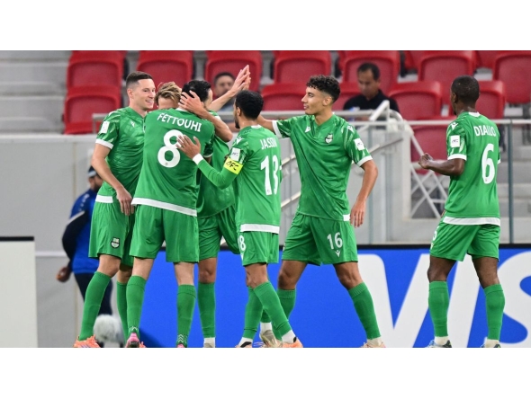 Al Ahli players celebrate during the match.  