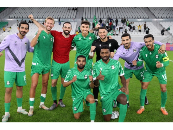 Al Ahli players celebrate their win.