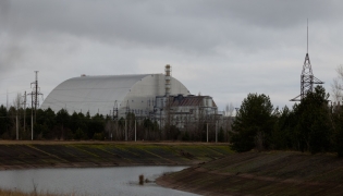 This photograph shows the containment vessel of the New Safe Confinement (NSC) which contains radiation from the remains of reactor 4 of the former Chernobyl Nuclear Power Plant, in Chernobyl, on December 22, 2025, amid the Russian invasion of Ukraine. Photo by Tetiana Dzhafarova / AFP
