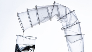 An illustration photograph taken in Paris, on July 31, 2019 shows disposable plastics cups.  (Photo by Joel Saget / AFP)