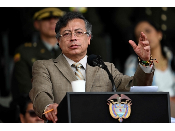 Colombia's President Gustavo Petro delivers a speech during the commemoration of the 134th anniversary of the National Police and the promotion of officers at the General Santander Police Academy in Bogota on November 13, 2025. (Photo by Raul Arboleda/ AFP)
