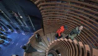 Pictures taken on December 9, 2025, shows people visiting a bookstore in Tianjin. (Photos by Adek Berry / AFP)