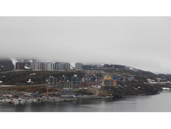 (Files) Houses are pictured in Nuuk, Greenland, on June 15, 2025. (Photo by Ludovic MARIN / AFP)

