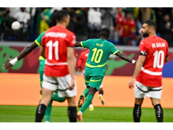 Egypt's forward #10 Mohamed Salah celebrates after the Africa Cup of Nations (CAN) semi-final football match between Senegal and Egypt at the Grand stadium in Tangiers on January 14, 2026. (Photo by SEBASTIEN BOZON / AFP)