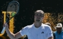Germany's Alexander Zverev celebrates after his victory against Canada's Gabriel Diallo during their men's singles match on day one of the Australian Open tennis tournament in Melbourne on January 18, 2026. (Photo by Paul Crock / AFP)