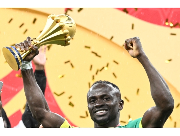 Senegal's forward #10 Sadio Mane holds the trophy after the Africa Cup of Nations (CAN) final football match between Senegal and Morocco at the Prince Moulay Abdellah Stadium in Rabat on January 18, 2026. (Photo by Sebastien Bozon / AFP)