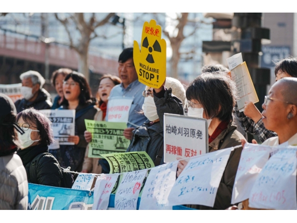 Participants demonstrate in front of Tokyo Electric Power Company's headquarters, against the restart of the Kashiwazaki-Kariwa Nuclear Power Plant, in Tokyo on January 19, 2026. (Photo by Kazuhiro NOGI / AFP)