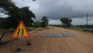 A general view of a damaged road on the way from Giyani to Mbaula on January 17, 2026 following heavy rains over much of the Limpopo Province, South Africa (Photo by LUCAS LEDWABA / AFP)
