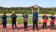 Qatar shooters Mohammed Al Rumaihi and Kholoud Al Khalaf celebrate their mixed team trap triumph. 