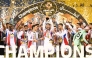 Sharjah players celebrate with the Qatar-UAE Super Cup.  
