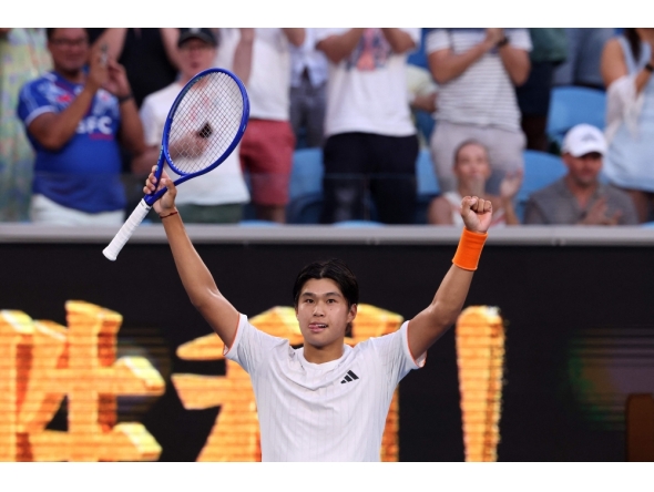 USA's Learner Tien celebrates victory over Russia's Daniil Medvedev after their men's singles match on day eight of the Australian Open tennis tournament in Melbourne on January 25, 2026. (Photo by David Gray / AFP)