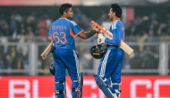 India's Abhishek Sharma and captain Suryakumar Yadav celebrate their team's win at the end of the third Twenty20 between India and New Zealand at Guwahati on January 25, 2026. (Photo by Biju BORO / AFP) 