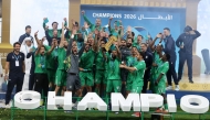 Al Ahli players and officials celebrate their victory.
