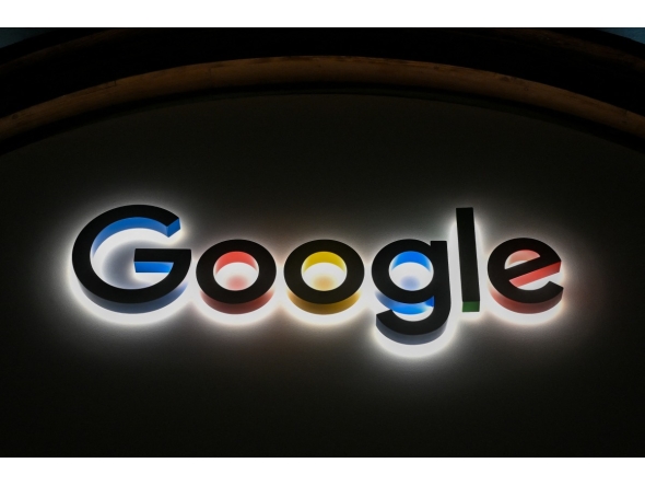 This photograph taken on January 22, 2026, shows a sign of US technology company Google displayed during the World Economic Forum (WEF) annual meeting in Davos. (Photo by Fabrice COFFRINI / AFP)
