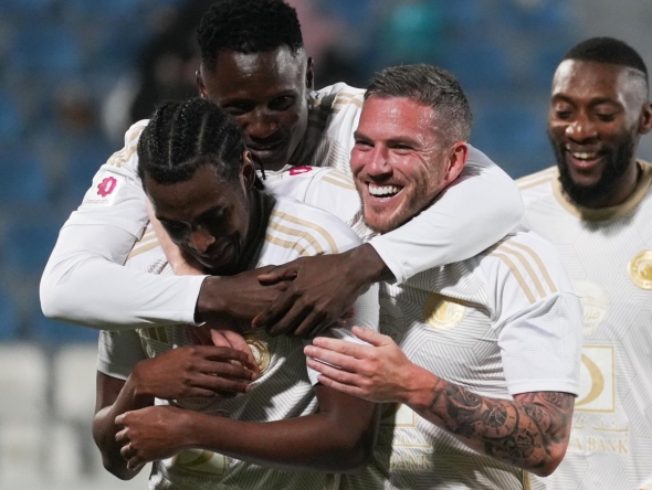 Al Arabi players celebrate during the match against Umm Salal.