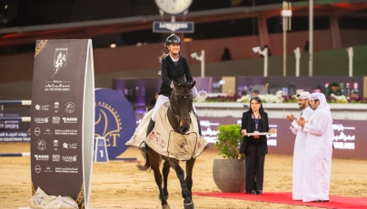 Kristen Vanderveen celebrates with her 12-year-old gelding Bull Run’s Jireh after winning the CSI5* jump-off 155cm class during the final round of the HH The Father Amir’s Prix at Al Shaqab yesterday. The winners of the class were presented trophies by Abdullah al-Qashouti, the tournament's Marketing and Communications Director.