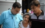 Human rights activist Javier Tarazona (L) greets his brother Jose Rafael Tarazona (R) and his mother Teresa de Jesus Sanchez after his release from prison at La Candelaria church in Caracas on February 1, 2026. (Photo by Federico PARRA / AFP)