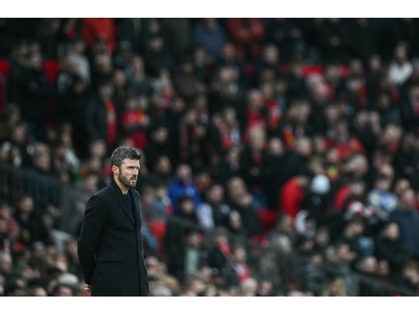Manchester United's English interim head coach Michael Carrick looks on during the English Premier League football match between Manchester United and Fulham at Old Trafford in Manchester, north west England, on February 1, 2026. (Photo by Paul ELLIS / AFP)