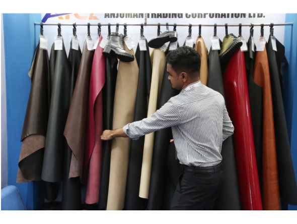 An exhibitor arranges leather products at the 9th edition of Bangladesh Leather and Footwear Expo in Dhaka, Bangladesh, on July 24, 2025. (Photo by Habibur Rahman/Xinhua)