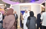 Visitors at the Media City booth during the Web Summit Qatar.