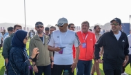 Speaker of the Shura Council H E Hassan bin Abdullah Al Ghanim with other officials during the National Sport Day event.