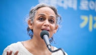 (Files) Indian author Arundhati Roy speaks during a press conference in Seoul on November 25, 2021. (Photo by Anthony Wallace / AFP)