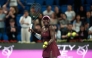 Canada's Victoria Mboko reacts after beating Latvia's Jelena Ostapenko in semi-final match at the Qatar Open tennis tournament in Doha on February 13, 2026. (Photo by Karim Jaafar / AFP)