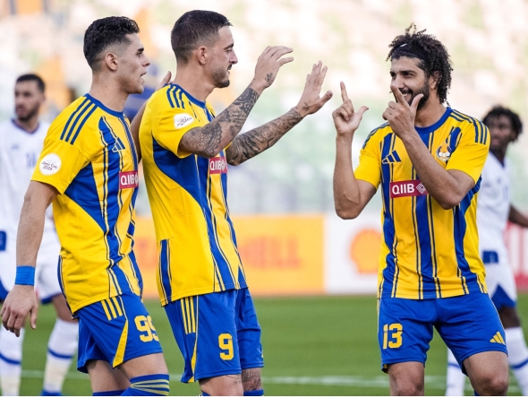 Al Gharafa’s Joselu (centre) celebrates with teammates.  