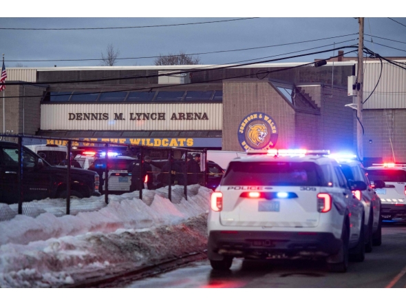 Police stand outside the perimeter they created around the Dennis M. Lynch Arena where a shooting occurred earlier today in Pawtucket, Rhode Island, on February 16, 2026. Photo by Joseph Prezioso / AFP