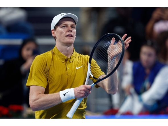 Italy's Jannik Sinner greets the fans after defeating Australia's Alexei Popyrin in their men singles match at the Qatar Open tennis tournament in Doha on February 18, 2026. (Photo by Karim JAAFAR / AFP)