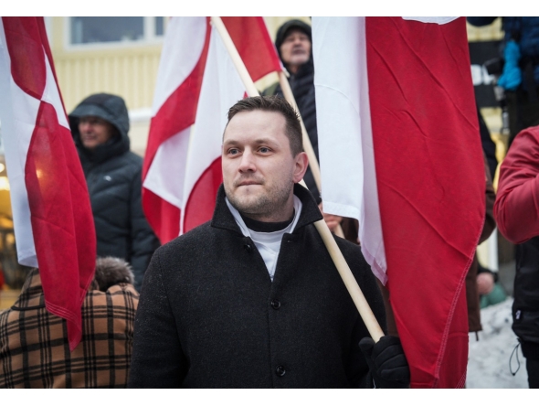Greenlandic Prime Minister Jens-Frederik Nielsen takes part in a demonstration that gathered almost a third of the city population to protest against the US President's plans to take Greenland, on January 17, 2026 in Nuuk, Greenland. Photo by Alessandro RAMPAZZO / AFP