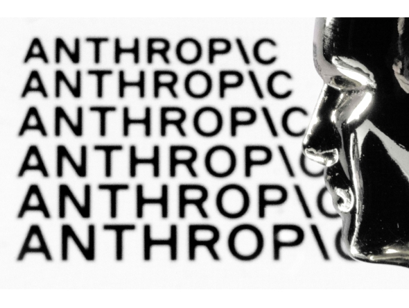 This illustration photograph shows a figurine in front of the logo of the US artificial intelligence safety and research company Anthropic during a photo session in Paris on February 13, 2026.  (Photo by Joel Saget / AFP)