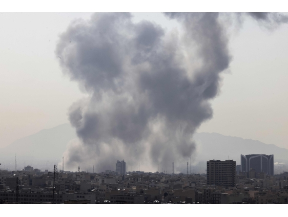 A plume of smoke rises following a reported explosion in Tehran on February 28, 2026. Two loud blasts were heard in Tehran on February 28 morning by AFP journalists, and two plumes of thick smoke were seen over the centre and east of the Iranian capital (Photo by Atta Kenare/ AFP)