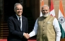 India's Prime Minister Narendra Modi (R) shakes hands with his Canadian counterpart Mark Carney before their meeting at the Hyderabad House in New Delhi on March 2, 2026. (Photo by Sajjad Hussain / AFP)