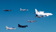 This handout image taken on July 23, 2024 and released by the Australian Defence Force shows a Royal Australian Air Force (RAAF) E-7A Wedgetail airborne early warning and control aircraft (top R) in formation flight with an RAAF EA-18G Growler electronic warfare aircraft (bottom R), RAAF F/A-18F Super Hornet (top C), a Spanish Navy AV-8B Harrier II (bottom C), an F-35 Lightning II (top L), a Japan Air Self-Defense Force Mitsubishi F-2 (bottom 2nd L), and a Philippine Air Force FA-50 Golden Eagle (bottom L) over northern Australia during Exercise Pitch Black 2024. (Photo by Handout / Australia Defence Force / AFP) 