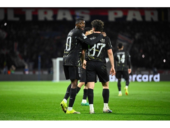 Paris Saint-Germain's French forward #10 Ousmane Dembele (L) reacts with Paris Saint-Germain's Portuguese midfielder #87 Joao Neves during the UEFA Champions League round of 16 first leg football match between Paris Saint-Germain (PSG) and Chelsea at the Parc des Princes stadium in Paris on March 11, 2026. (Photo by JULIEN DE ROSA / AFP)