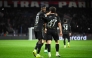 Paris Saint-Germain's French forward #10 Ousmane Dembele (L) reacts with Paris Saint-Germain's Portuguese midfielder #87 Joao Neves during the UEFA Champions League round of 16 first leg football match between Paris Saint-Germain (PSG) and Chelsea at the Parc des Princes stadium in Paris on March 11, 2026. (Photo by JULIEN DE ROSA / AFP)