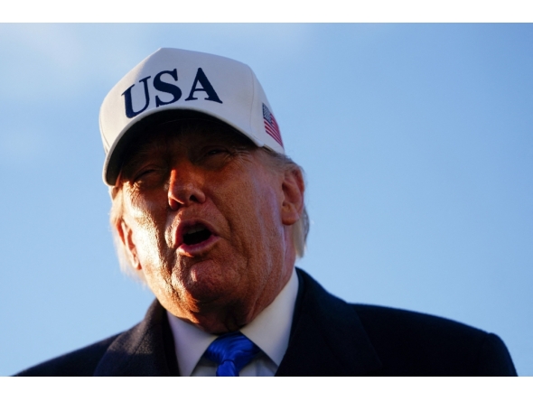 US President Donald Trump speaks to the media before boarding Air Force One on March 13, 2026 at Joint Base Andrews, Maryland. Nathan Howard/Getty Images/AFP 