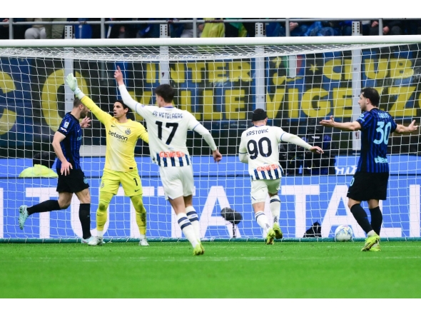 Atalanta's Montenegrin forward #90 Nikola Krstovic (2R) scores his team's first goal during the Italian Serie A football match between Inter Milan and Atalanta at the San Siro stadium in Milan, northern Italy, on March 14, 2026. (Photo by MARCO BERTORELLO / AFP)
