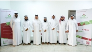 CEO of Thani Bin Abdullah Foundation for Humanitarian Services, Ayed bin Dabsan Al-Qahtani, with officials from the foundation's Gharimin Committee.