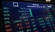 Stock market numbers are displayed on the floor of the New York Stock Exchange during morning trading on March 25, 2026 in New York City. Photo by Michael M. Santiago / GETTY IMAGES NORTH AMERICA / Getty Images via AFP