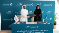 Assistant Secretary-General for National Development Planning and Policy Affairs at the NPC, Raed Ibrahim Al Emadi and Executive Director of DIFI, Dr. Sharifa Noaman Al Emadi at the MoU signing.