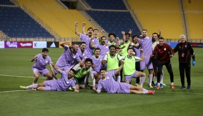 Muaither players celebrate their victory.