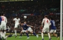 England's defender Marc Guehi (L) heads towards goal during the friendly international football match between England and Japan at Wembley Stadium in London on March 31, 2026. (Photo by Adrian Dennis / AFP) 
