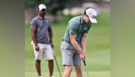Calum Fitzgerald putts the ball.