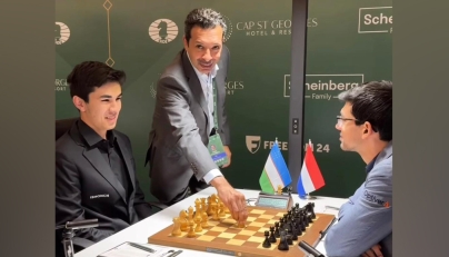 President of the Qatar Chess Federation Mohammed Al-Mudahka makes the ceremonial first move during the match at the Candidates Championship in Cyprus.