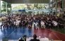 A group of men wait for the drawing of the Thai military conscription lottery at Watmatchantikaram School in Bangkok on April 7, 2026. (Photo by Chanakarn Laosarakham / AFP)