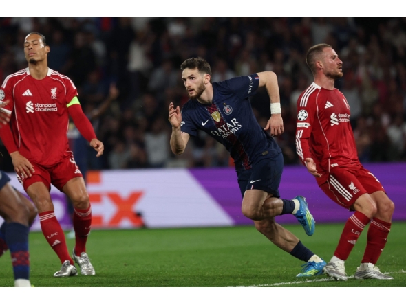Paris Saint-Germain's Georgian forward #07 Khvicha Kvaratskhelia celebrates scoring his team's second goal during the UEFA Champions League quarter-final first leg football match between Paris Saint-Germain (PSG) and Liverpool FC at the Parc des Princes stadium in Paris on April 8, 2026. (Photo by Anne-Christine POUJOULAT / AFP)